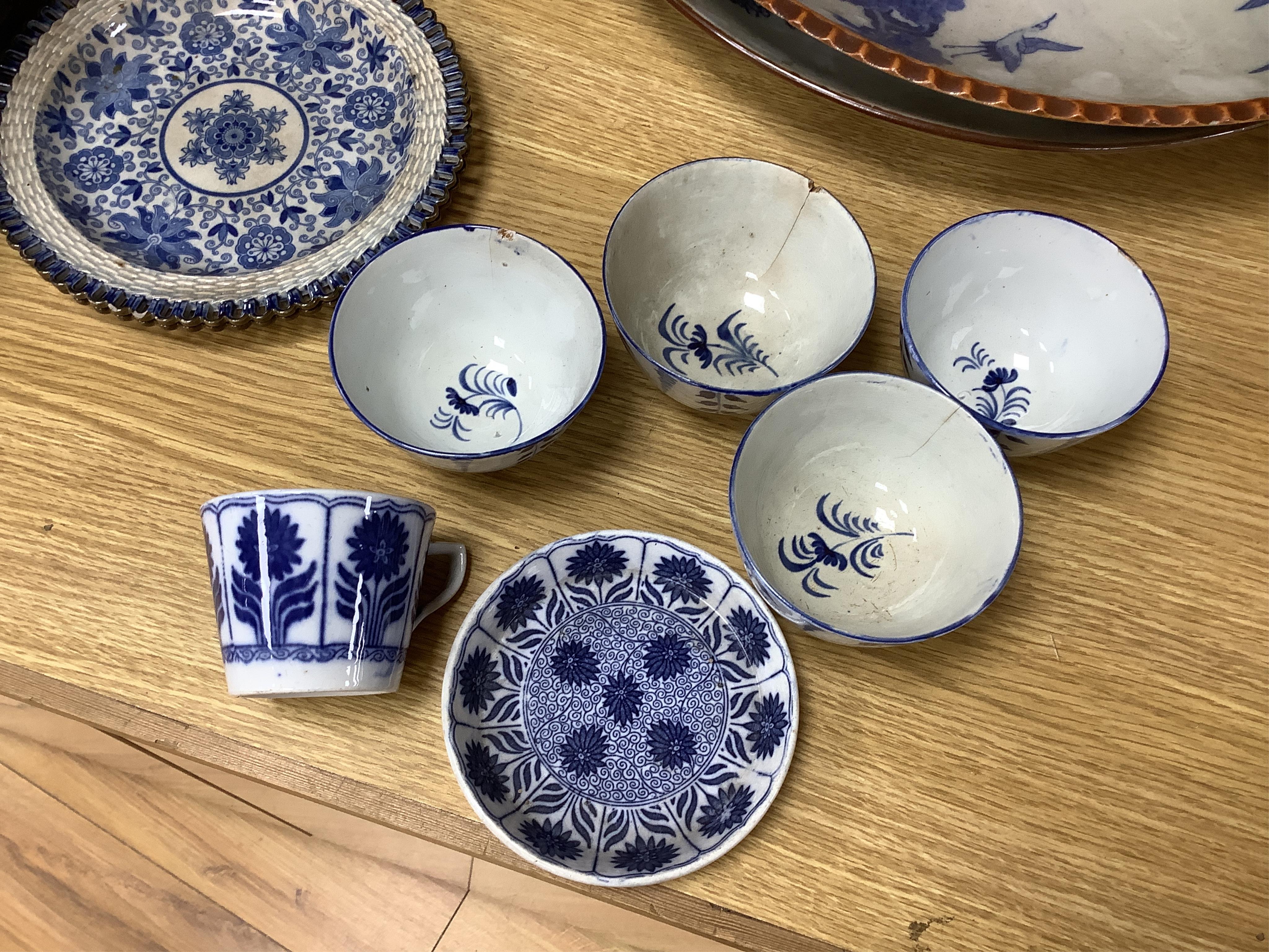 A group of 19th century pearlware set of tea bowls and saucers and to similar basket with border plates